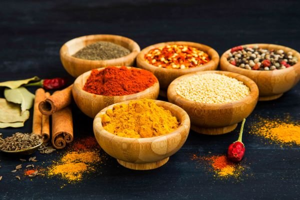 Organic Indian Spices in USA – Assorted natural spices in wooden bowls